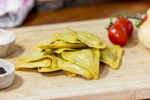 stock-photo-gourmet-pasta-making-theme-with-tomatoes-and-pair-of-jars-olive-oil-rosemary-sprig-and-other-502967587_500x